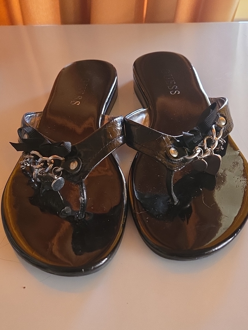 Guess Black Patent Thong Sandals with Chain & Bow Detail